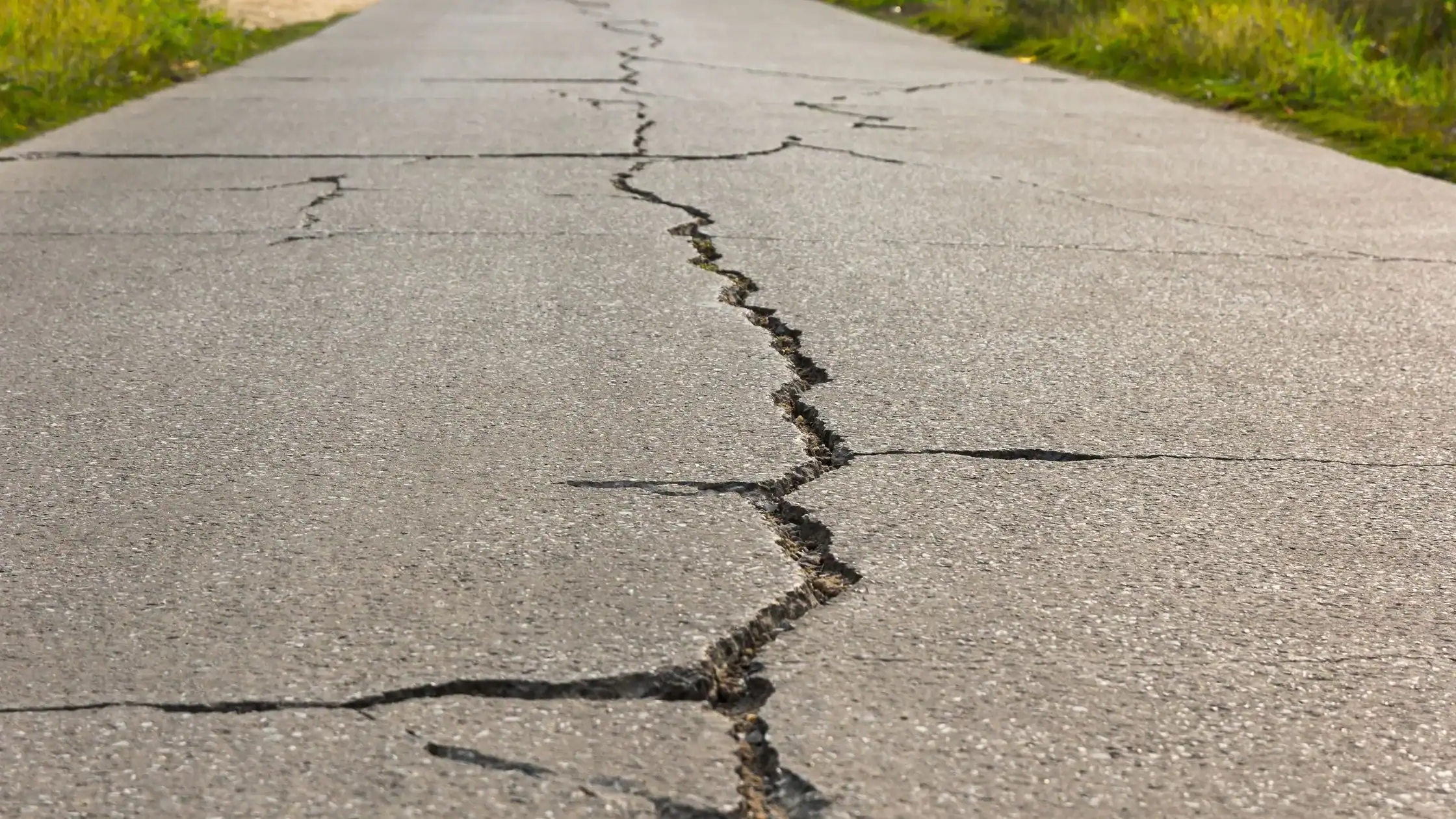 What are the most common causes of cracks in concrete structures, and how can they be prevented or repaired?